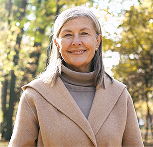 Older woman in autumn scene